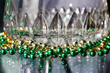 Abstract background of modern lead crystal glass reflecting color in beads with bokeh