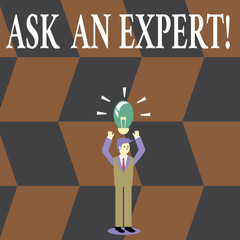 Writing note showing Ask An Expert. Business concept for confirmation that have read understand and agree with guidelines Businessman Raising Arms Upward with Lighted Bulb icon above
