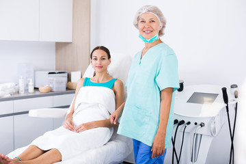 Obraz premium Professional mature beautician in medical esthetic office