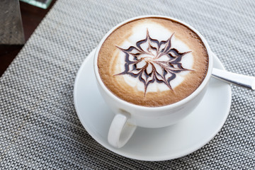 Close shots, hot coffee in a white cup