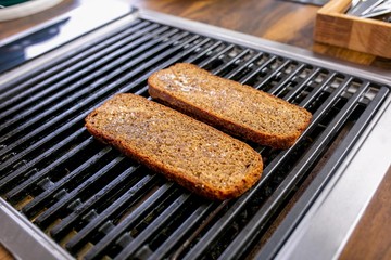 Bread slices are grilled. Master class in the kitchen. The process of cooking. Step by step. Tutorial. Close-up