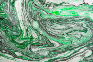 Beautiful abstract Ebru drawing technique .Turkish style of painting Ebru on water with acrylic paints twists the waves.A stylish combination of natural luxury.Modern art 
