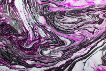 Beautiful abstract Ebru drawing technique .Turkish style of painting Ebru on water with acrylic paints twists the waves.A stylish combination of natural luxury.Modern art 