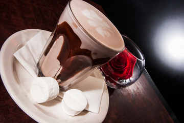 Coffee mug and glass with red rose