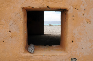 View of Beach framed by Window of Slave Hut