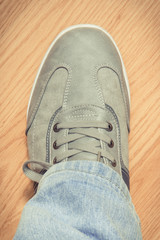 Casual gray leather shoe on board, male footwear concept