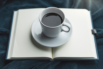 Notebook with coffee cup