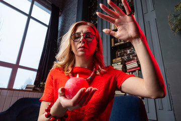 Astrologist wearing necklace and bracelet practicing future prediction