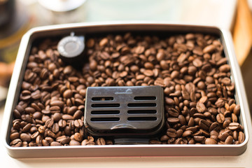 coffee beans in roast machine, arabica roasted coffee ,color vintage style.
