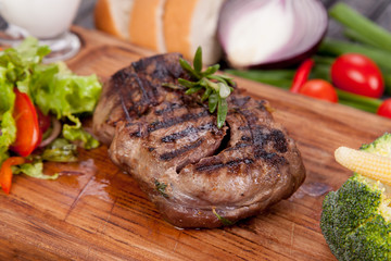  juicy and appetizing steak tamogavok of horse meat on the table, for design in cooking