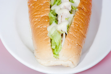 Close up of a salad bun with cheese