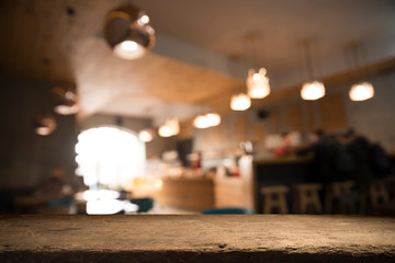 blurred background of bar and dark brown desk space of retro wood