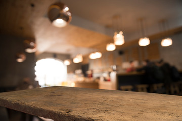 blurred background of bar and dark brown desk space of retro wood