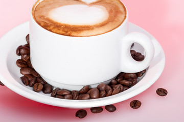 Milk mug with coffee beans and plate