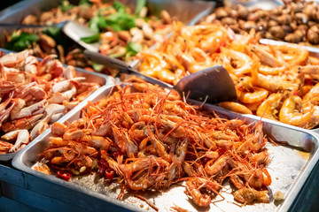 Fried shrimp in street food stall in Asian night market