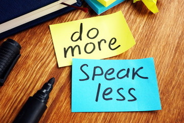 Do more speak less written on a color papers.