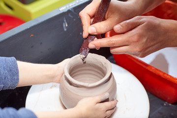 Modeling of clay on a potter's wheel In the pottery workshop