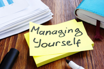 Managing yourself. Office table with papers. Self management concept. - obrazy, fototapety, plakaty