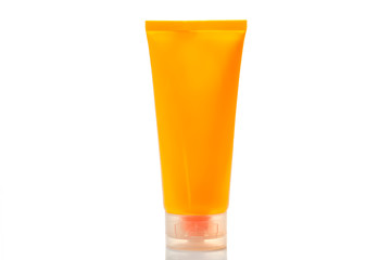  Sunny orange colored beauty cosmetics tube; branding mock up isolated on  white. Trendy neon color.