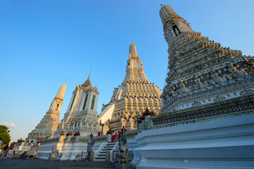 Ancient white pagoda of Wat Arun the famous temple in Bangkok