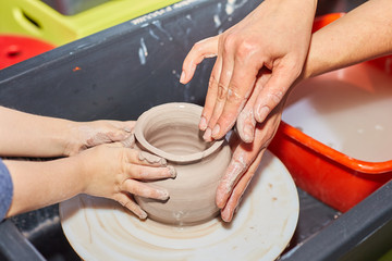 Modeling of clay on a potter's wheel In the pottery workshop