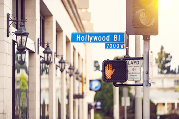 Hollywood blvd street sign on a cross walk in the streets of Los Angeles