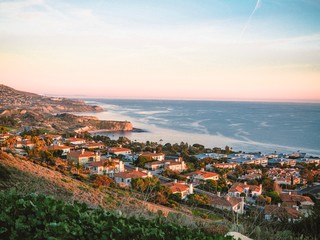 Panorama of Los Angeles, the coast and coastal houses photographed from the hill, everywhere palm trees, ocean