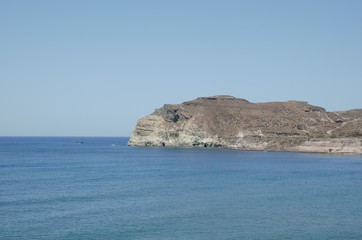 Fototapeta na wymiar Amazing Mediterranean sea view from the black beach in Santorini 