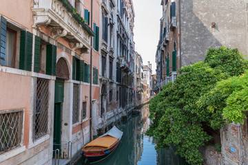Fototapeta na wymiar Panoramic view of Venice narrow canal with historical buildings and boat