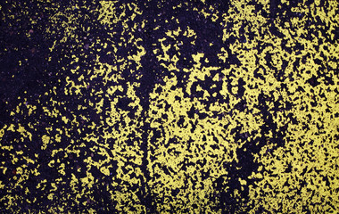 old colored road markings. yellow spots on old asphalt