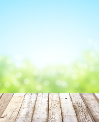 Wooden table top on blurred nature background