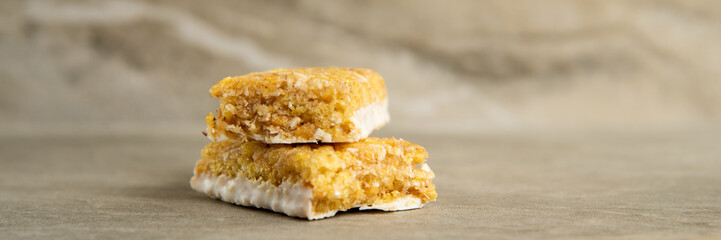 Muesli and cereal bar on marble stone background