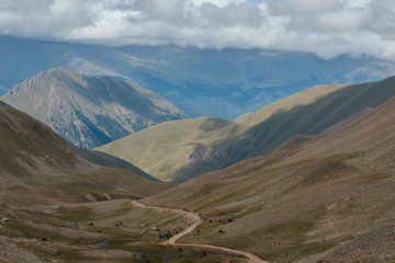 Panorama of road in mountains ofnational park Dombay, Caucasus
