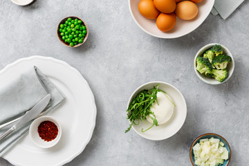 Raw ingredients cooking broccoli frittata concrete background top view