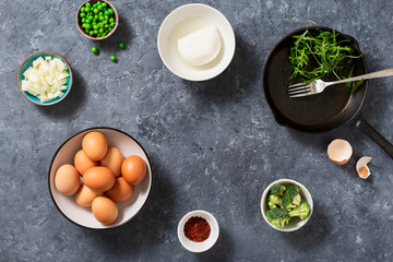 Obraz na płótnie Canvas Raw ingredients cooking broccoli frittata top view