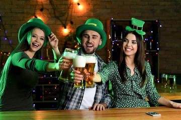Young people celebrating St. Patrick's Day in pub