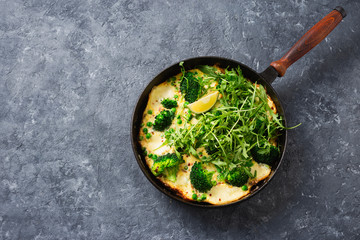 Broccoli green mozzarella cheese peas frittata frying pan top view