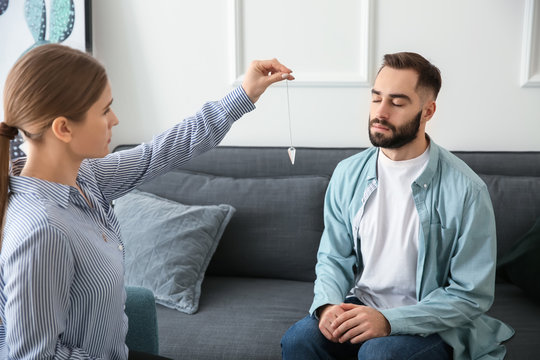 Young man during hypnosis session in psychologist's office