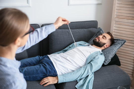 Young man during hypnosis session in psychologist's office