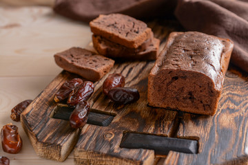 Tasty homemade cake on wooden board, closeup