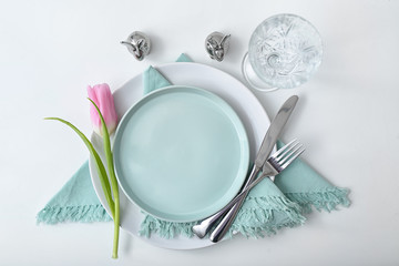 Beautiful Easter table setting on white background
