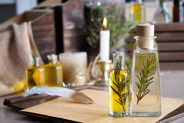 Bottles of rosemary oil on table