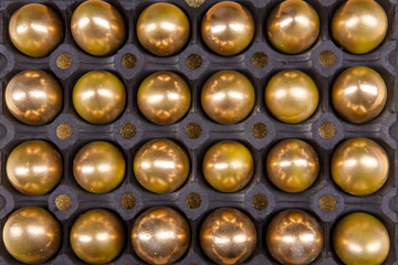 black egg package with golden easter eggs