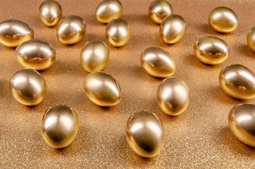 golden easter eggs on a golden background
