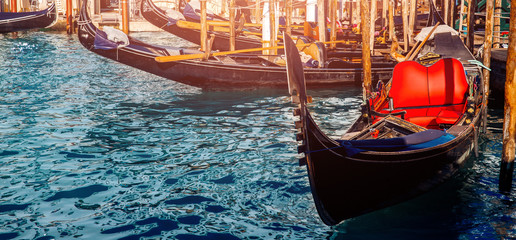 Venetian gondola in middle of canal at boarding point © Parilov