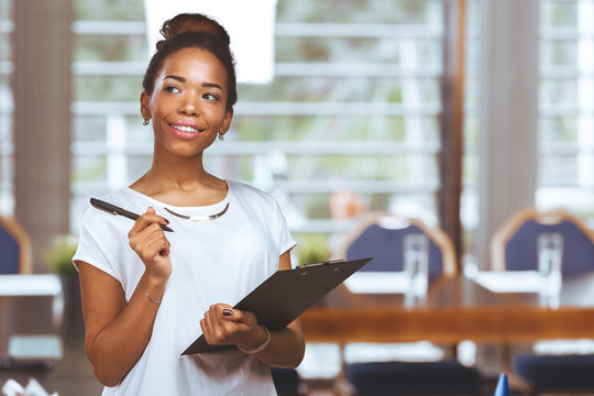 Young Beautiful African American Woman With Clipboard