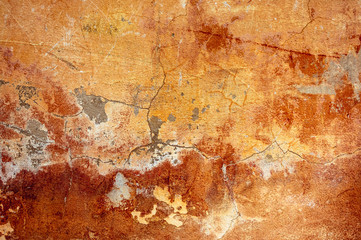 Cracked and peeling paint old wall background.