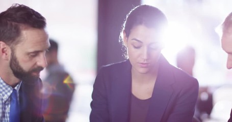 4K Business woman with digital tablet explaining an idea to male colleagues