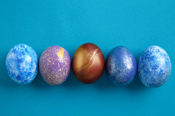 Beautiful Easter eggs on color background