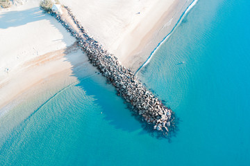 Beautiful beach scenes with nice blue turquoise water, gentles waves and nice sand. Warm and tropical beach vibes with rocks and white sand.